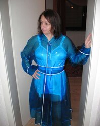 Wifey in girdle and PVC Raincoat