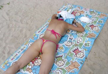 Korean nymph naked at the beach
