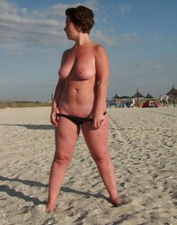 Youthful huge-boobed lady on the beach - N. C.