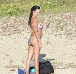 Penelope Cruz Caught Braless on Beach Vacation