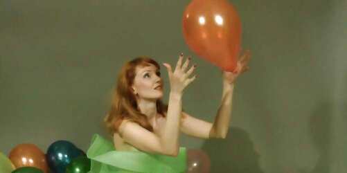 Redhead lean Lisa popping balloons
