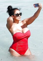 Kiara Mia In A Crimson Swimsuit in South Beach