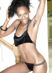 Nikki, astounding black with fur covered armpits and muff