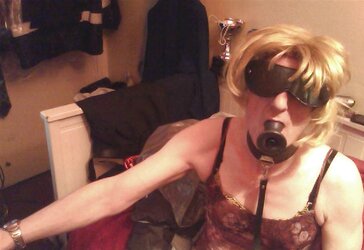 Annie blindfolded and ball-gagged
