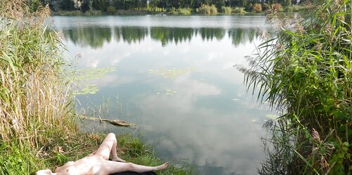 Sunbathing super-hot blonde doll at a lake