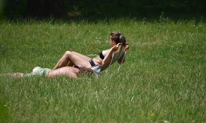Lady sunbathing in the park I