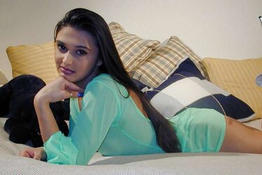 Kavitha sidhu green clothes on sofa